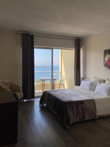 Postel nebo postele na pokoji v ubytování Sun Beach