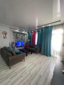 TV a/nebo společenská místnost v ubytování Nick Appartment Batumi