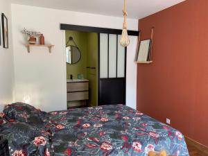 a bedroom with a bed and a black door at Chambre du Cotentin in Créances +13 photos