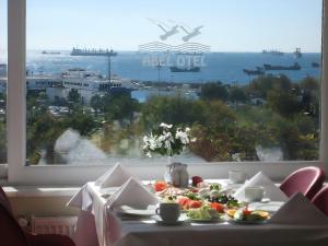 a table with food on it in front of a window at Abel Hotel in Istanbul +20 photos