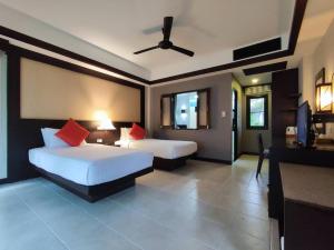 Postel nebo postele na pokoji v ubytování Nang Thong Bay Resort