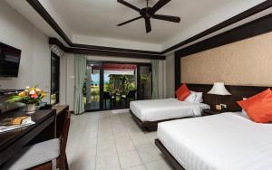 Postel nebo postele na pokoji v ubytování Nang Thong Bay Resort