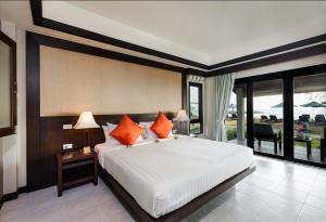 Postel nebo postele na pokoji v ubytování Nang Thong Bay Resort
