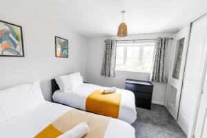 a bedroom with two beds and a window at 2Bed Garden & Private Parking Near A19 - Perfect for Contractors in Pallion