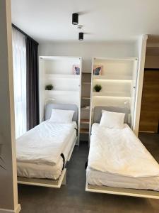 Posteľ alebo postele v izbe v ubytovaní Smart Apartament Grunwaldzka 240