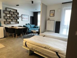 Posteľ alebo postele v izbe v ubytovaní Smart Apartament Grunwaldzka 240