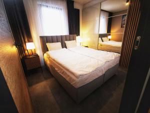 Posteľ alebo postele v izbe v ubytovaní Smart Apartament Grunwaldzka 240