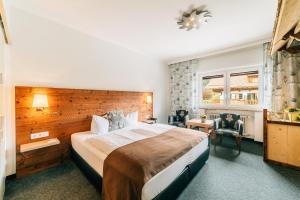 Postel nebo postele na pokoji v ubytování Hotel Alpensonne