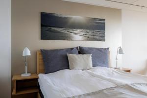 Voodi või voodid majutusasutuse Fredensborg Badehotel toas