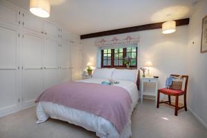 Voodi või voodid majutusasutuse Whitley Farm Cottage toas