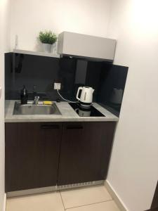 Kuchyňa alebo kuchynka v ubytovaní Apartamenty Wakacyjna Wioska Ngô 20m od Suntago