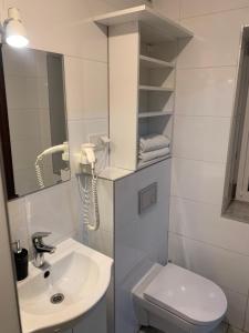Kúpeľňa v ubytovaní Apartamenty Wakacyjna Wioska Ngô 20m od Suntago