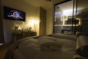 Garden Luxury Rooms客房内的一张或多张床位