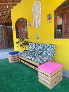 a couch sitting in the corner of a house at Canto da Gaivota Lençóis Maranhenses in Santo Amaro