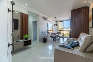 Et tv og/eller underholdning på UML - Apartamentos quadra mar em Bombinhas