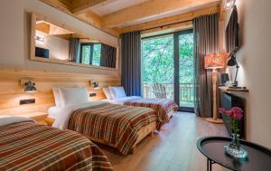 Letto o letti in una camera di 1740 Boutique Hotel Kazbegi