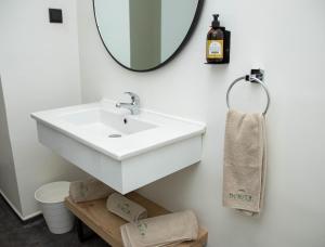 a bathroom with a white sink and a mirror at Hotel Ibn Khaldoun in Tunis +18 photos