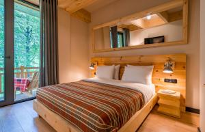 Letto o letti in una camera di 1740 Boutique Hotel Kazbegi