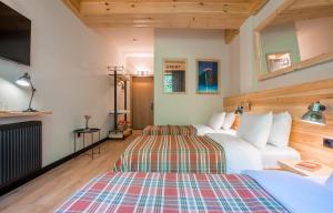 Letto o letti in una camera di 1740 Boutique Hotel Kazbegi