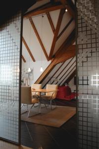 a dining room with a table and chairs at Gasthof zum Grünen Baum Komfort Suite in Rothenburg ob der Tauber