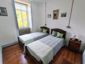 Ένα ή περισσότερα κρεβάτια σε δωμάτιο στο Casa Folhas Novas