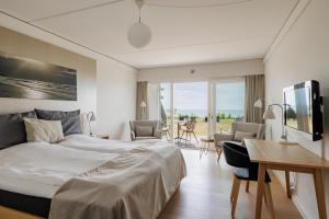 Voodi või voodid majutusasutuse Fredensborg Badehotel toas