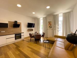 a living room with a couch and a table at City center appartment in Pula