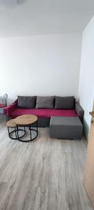 a living room with a couch and a table at Apartments pasta in Poljica