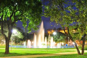 a water fountain in a park at night at kit net central 1 in Serra Negra +10 photos