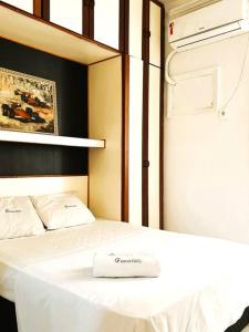 Postel nebo postele na pokoji v ubytování Apartamento na Orla de Copacabana