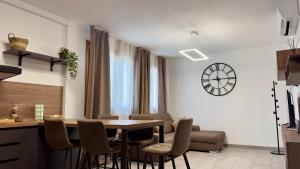 a kitchen and dining room with a table and chairs at Casa Faét in Adro