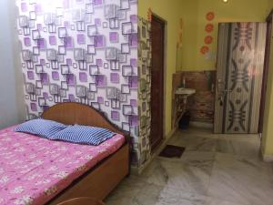 Postel nebo postele na pokoji v ubytování Amar priya guest house + 15 fotografií