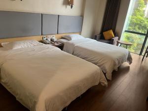 成都鹭湖花园酒店(四河地铁站店)客房内的一张或多张床位