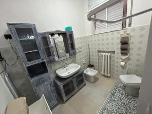 a bathroom with a sink and a toilet at Casa Giulia in Porto SantʼElpidio