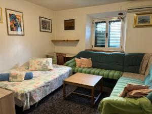 a living room with a couch and a table at Apartments Hana in Makarska