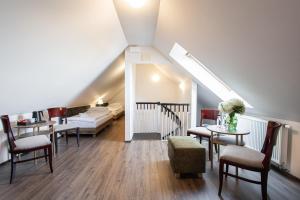 Posteľ alebo postele v izbe v ubytovaní Hotel Tanzberg Mikulov