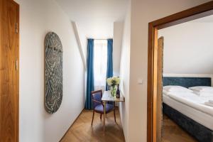 Posteľ alebo postele v izbe v ubytovaní Hotel Tanzberg Mikulov