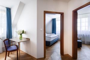 Posteľ alebo postele v izbe v ubytovaní Hotel Tanzberg Mikulov