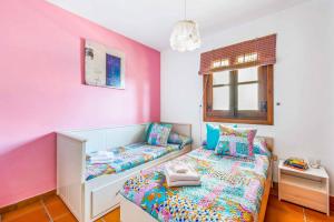 Łóżko lub łóżka w pokoju w obiekcie Villa Capistrano
