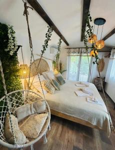 a bedroom with a swinging bed in a room at La Villa Tosca in Callas +41 photos