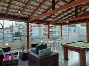 Uma área de estar em Bombinhas Praia Apart Hotel - unidade rua Bem Te Vi