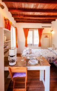 a dining room with a table and a bed at KAVURLUKOZ KaraburuN in Karaburun +36 photos