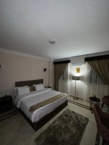 Voodi või voodid majutusasutuse Aziz Egypt Pyramids Hotel toas