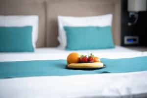 Voodi või voodid majutusasutuse Hotel Prezident toas