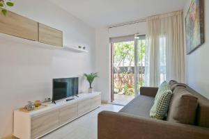 TV a/nebo společenská místnost v ubytování Apartamentos Velor