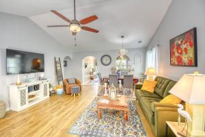 a living room with a green couch and a table at SUMMER Vacation Getaway Pets Welcome Remodeled in Myrtle Beach
