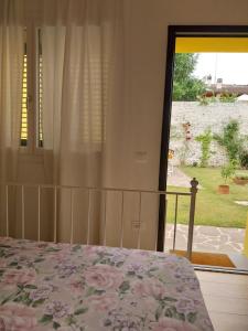 Postel nebo postele na pokoji v ubytování B&B La Casa Gialla