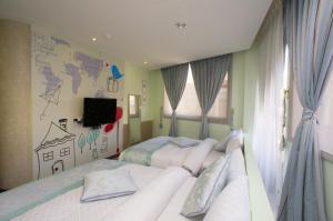 Llit o llits en una habitació de Chamie B&B