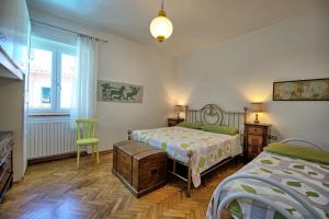 Ένα ή περισσότερα κρεβάτια σε δωμάτιο στο Villa Pratovecchio by PosarelliVillas +26 φωτογραφίες