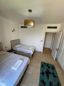A bed or beds in a room at New Marina MP 37